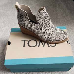 TOMS Black and White Wedge Shoes with Slip-On Design